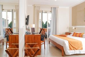 Postel nebo postele na pokoji v ubytování Hotel Michelangelo