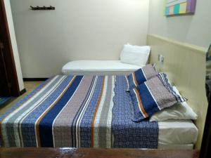 Cama ou camas em um quarto em Pousada Praia D'Azul