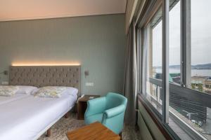 Кровать или кровати в номере Hotel Bahía de Vigo
