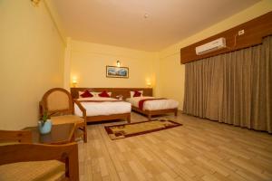 Uma cama ou camas num quarto em Hotel Elegant