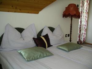 A bed or beds in a room at Beatrix Üdülőház