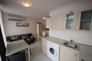 A kitchen or kitchenette at Menada Grand Kamelia Apartments