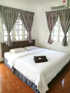 Vagary Pangkor tesisinde bir odada yatak veya yataklar