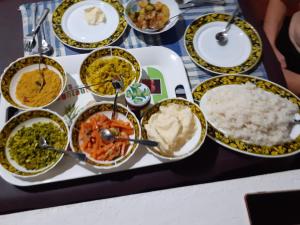 a table full of different types of food at Oceanic White House in Nilaveli