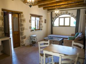 a living room with a table and a couch at To Spiti mas in Sougia