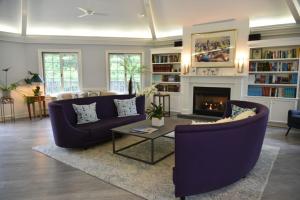 a living room with two couches and a fireplace at Southampton Inn in Southampton