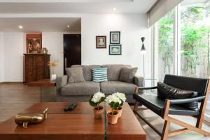 a living room with a couch and a table at Mi casa #1 at Polanco's most exclusive area in Mexico City