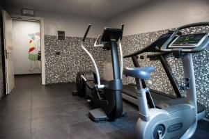 a gym with two exercise bikes in a room at Plus Florence in Florence