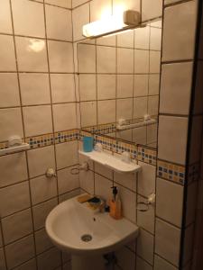 a bathroom with a sink and a mirror at Centre ville Avenue Hassan II in Agadir