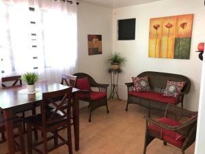 a dining room with a table and chairs at Brisas Del Mar 1/1 Front Beach Apartment in Rincon