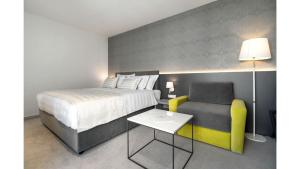Een bed of bedden in een kamer bij Boutique Hotel Mirjam