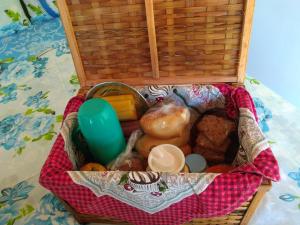 a basket filled with different types of food at Chalés Vale dos Pássaros in Paraty