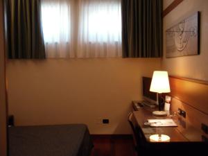 Postel nebo postele na pokoji v ubytování Best Western Hotel Dei Cavalieri