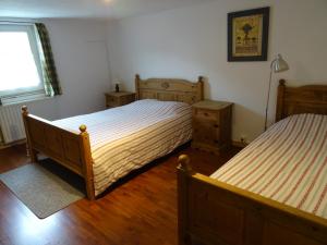 Кровать или кровати в номере Sneeuweifel