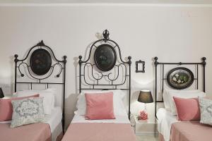 A bed or beds in a room at Il Piccolo Principe Affittacamere