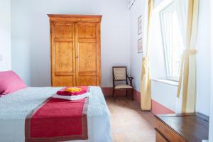 A bed or beds in a room at Tenuta La Santissima