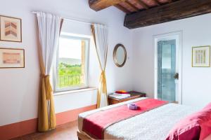 A bed or beds in a room at Tenuta La Santissima