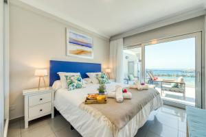 Ένα ή περισσότερα κρεβάτια σε δωμάτιο στο Amarre Beach