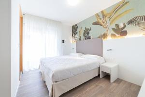 Postel nebo postele na pokoji v ubytování Hotel Columbia & Ninfea