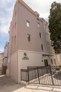 a building with a gate in front of it at Residence Stine in Split