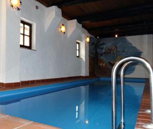 a swimming pool in a house with a swimming pooliterator at Naturhotel Hof Ehlers in Bergen