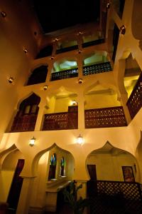 a view of a building with a staircase and a ceiling at Asmini Palace Hotel in Zanzibar City