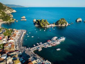 an aerial view of a harbor with boats in the water at The Well Parga in Parga
