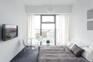 Cama o camas de una habitación en Platinum Sky