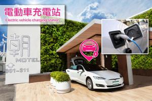 an electric vehicle charging station for a car at Chao Motel in Taoyuan