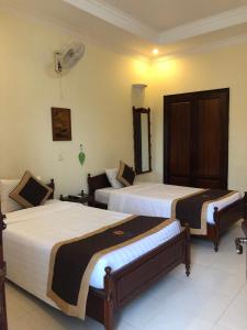 Un pat sau paturi într-o cameră la Huong Sen 2 Hotel