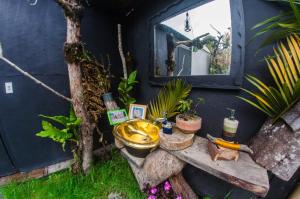 a bathroom with a sink and a mirror at Glamping Tierra Dulce in Supatá