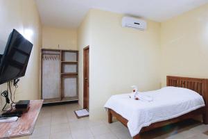 Ein Bett oder Betten in einem Zimmer der Unterkunft Sama Sama Bungalows