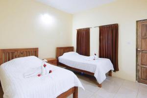 Ein Bett oder Betten in einem Zimmer der Unterkunft Sama Sama Bungalows