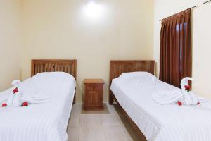 Ein Bett oder Betten in einem Zimmer der Unterkunft Sama Sama Bungalows