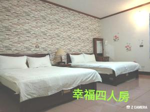 Postel nebo postele na pokoji v ubytování Ju Jia Xiao Zhan Homestay
