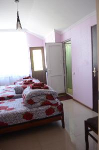 Ein Bett oder Betten in einem Zimmer der Unterkunft Alex's Cosy Guesthouse
