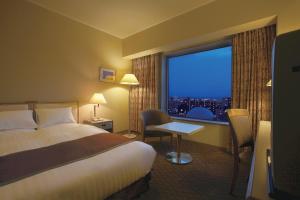 Postel nebo postele na pokoji v ubytování Miyako Hotel Yokkaichi