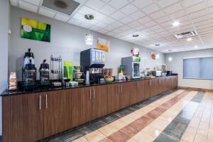 a restaurant with a counter top with a lecture room at Quality Inn & Suites Augusta I-20 in Augusta