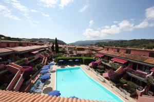 arial view of a resort with a swimming pool at Elba Vip in Porto Azzurro