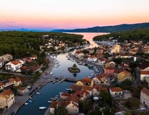an aerial view of a town with a river at Apartmani Lupi 2 M&S in Vrboska