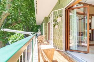 an outdoor deck with a bench on a house at First Class Rome Apartments in Rome