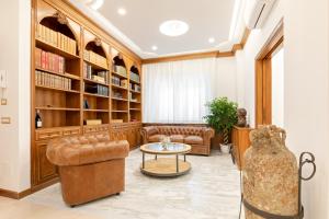a living room with a couch and a table at First Class Rome Apartments in Rome