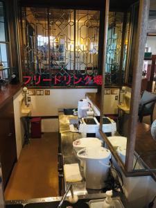 a kitchen with a counter with some dishes on it at 白樺湖榮園 in Chino
