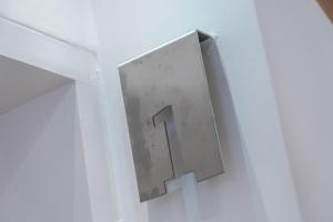 a metal plate on a door with a number one on it at Sta Catarina Design Apartments by Lisbon One in Lisbon