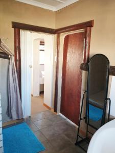 a hallway with a room with a door and a room with a room at Sunflower Self-Catering in Walvis Bay
