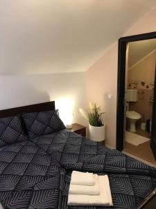 Un pat sau paturi într-o cameră la Wellion