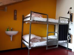 Postel nebo postele na pokoji v ubytování Attic Hostel Torino