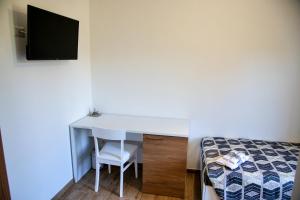 Postel nebo postele na pokoji v ubytování b&b binario nove e tre quarti