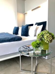 Uma cama ou camas num quarto em Blue City Apartments