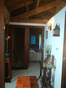 a room with a bedroom with a bed and a table at Casa Carola in Oia